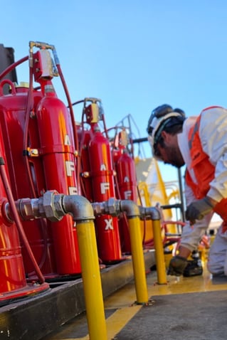 technician working on fire suppression tanks