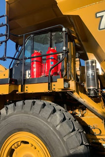 dry and liquid agent fire suppression tanks on mining haul truck